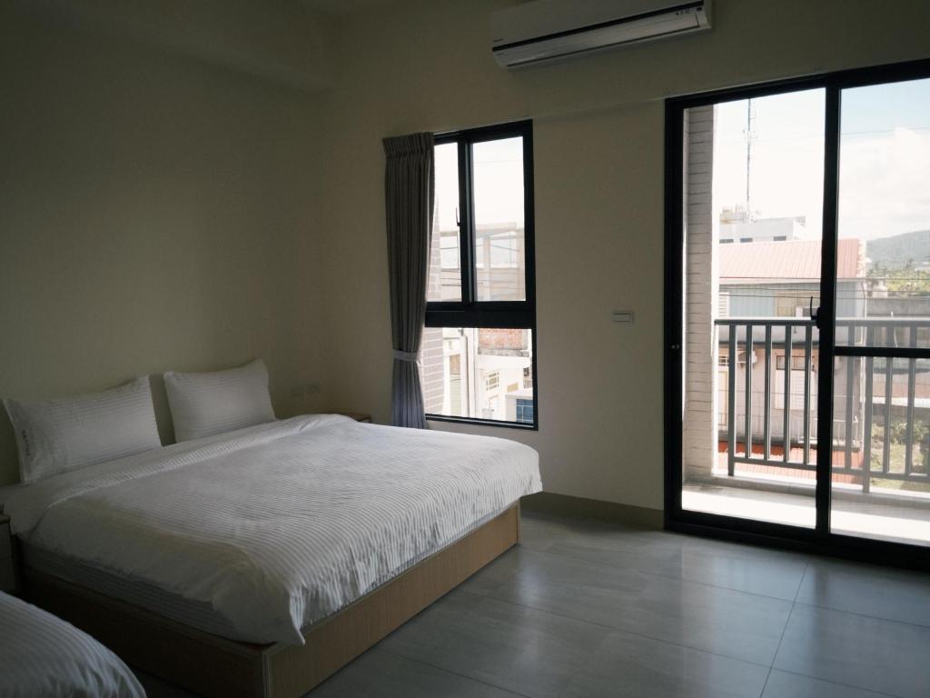 Postel nebo postele na pokoji v ubytování 瑞穗阿牛的家 Rui Sui Moo Guesthouse