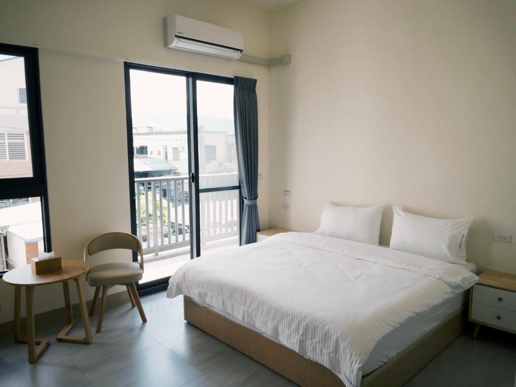 Postel nebo postele na pokoji v ubytování 瑞穗阿牛的家 Rui Sui Moo Guesthouse