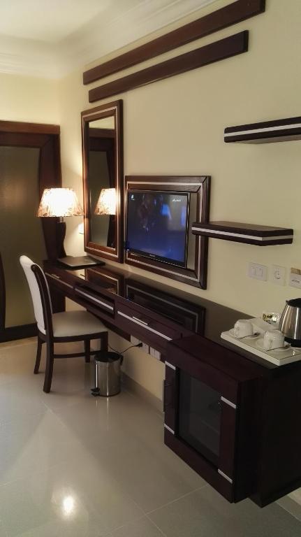 TV a/nebo společenská místnost v ubytování P Quattro Relax Hotel