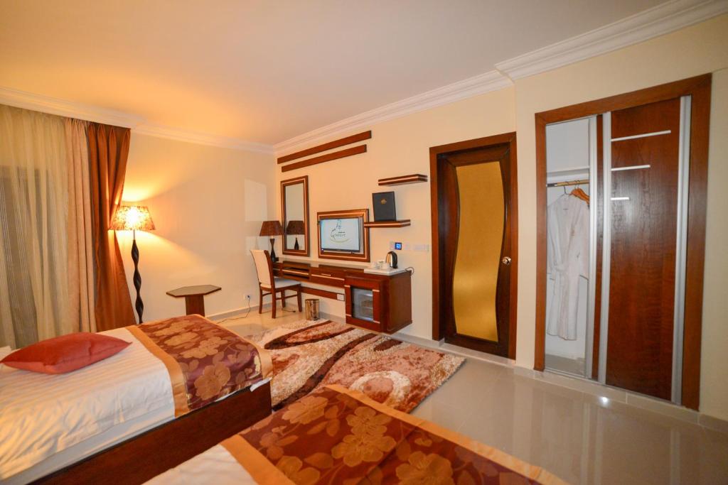 Postel nebo postele na pokoji v ubytování P Quattro Relax Hotel