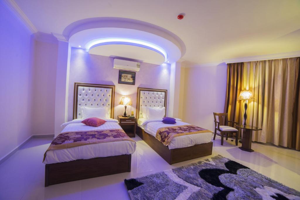 Postel nebo postele na pokoji v ubytování P Quattro Relax Hotel