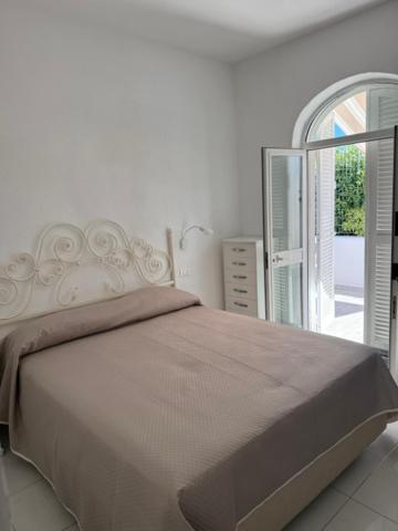 Postel nebo postele na pokoji v ubytování Fantasy House Ischia