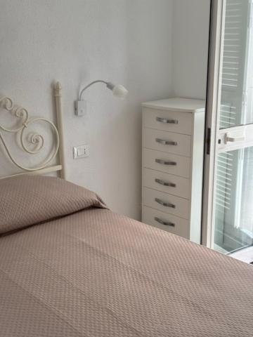 Postel nebo postele na pokoji v ubytování Fantasy House Ischia