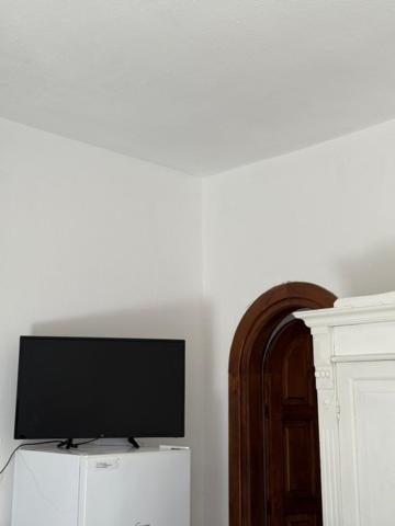 TV a/nebo společenská místnost v ubytování Fantasy House Ischia