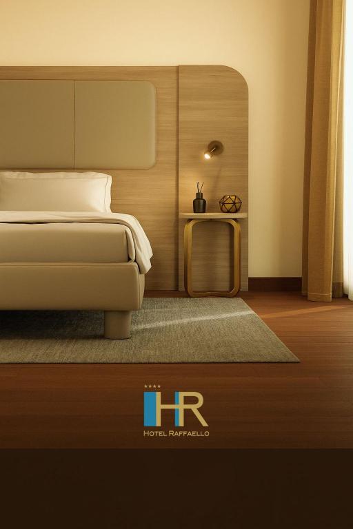 Posteľ alebo postele v izbe v ubytovaní Hotel Raffaello