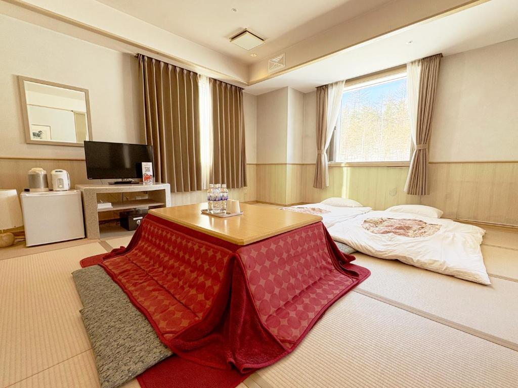 TV a/nebo společenská místnost v ubytování Palcall Tsumagoi Resort Ski & Hotel