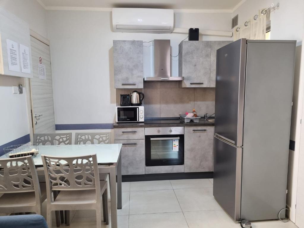Kuchyň nebo kuchyňský kout v ubytování Central Suites