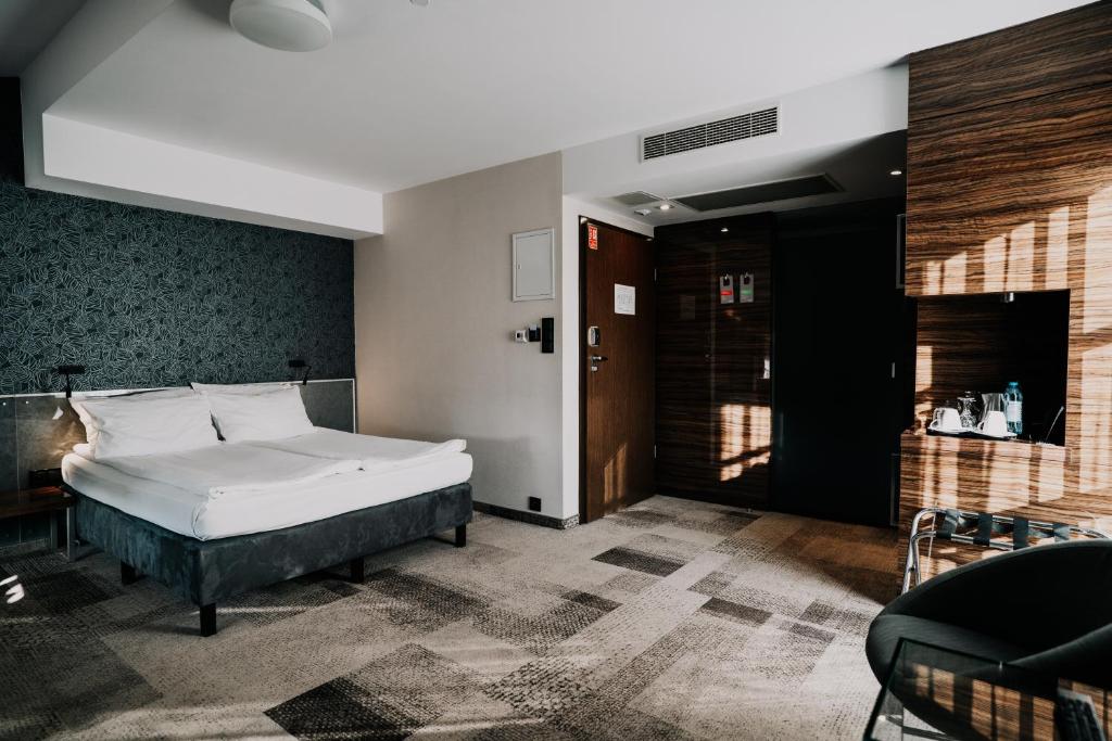 Posteľ alebo postele v izbe v ubytovaní Q Hotel Grand Cru Gdańsk