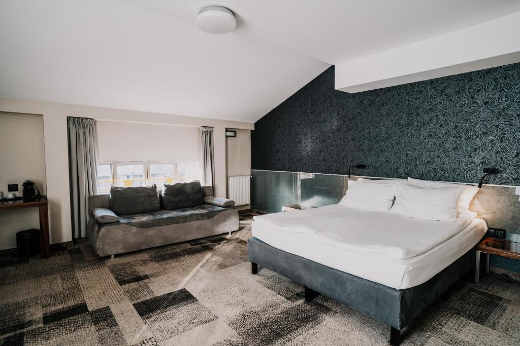Posteľ alebo postele v izbe v ubytovaní Q Hotel Grand Cru Gdańsk