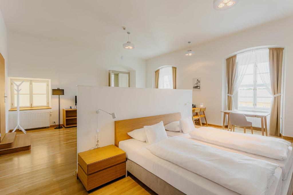 Postel nebo postele na pokoji v ubytování Hotel Benedict