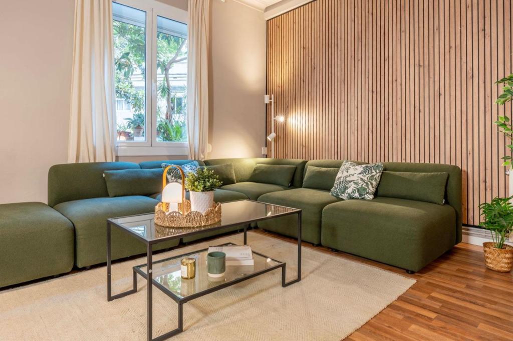 a living room with a couch and a table at Sagrada familia Secret Apartment in Barcelona