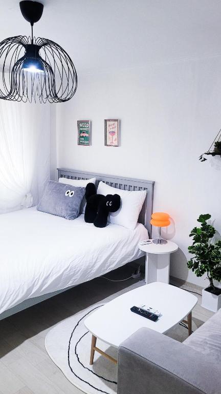 a bedroom with a bed with a teddy bear on it at Seoul Haven 3room KSPO-DOM Family trip in Seoul