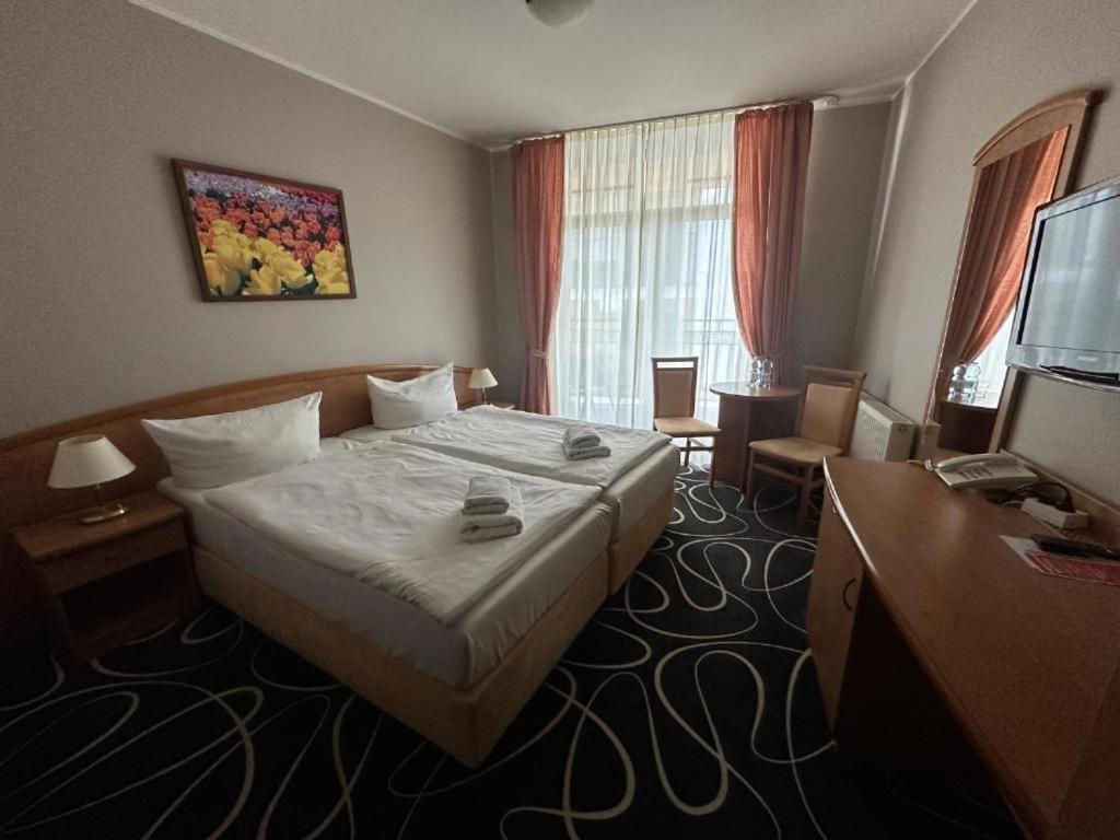 Postel nebo postele na pokoji v ubytování Trofana Wellness & SPA