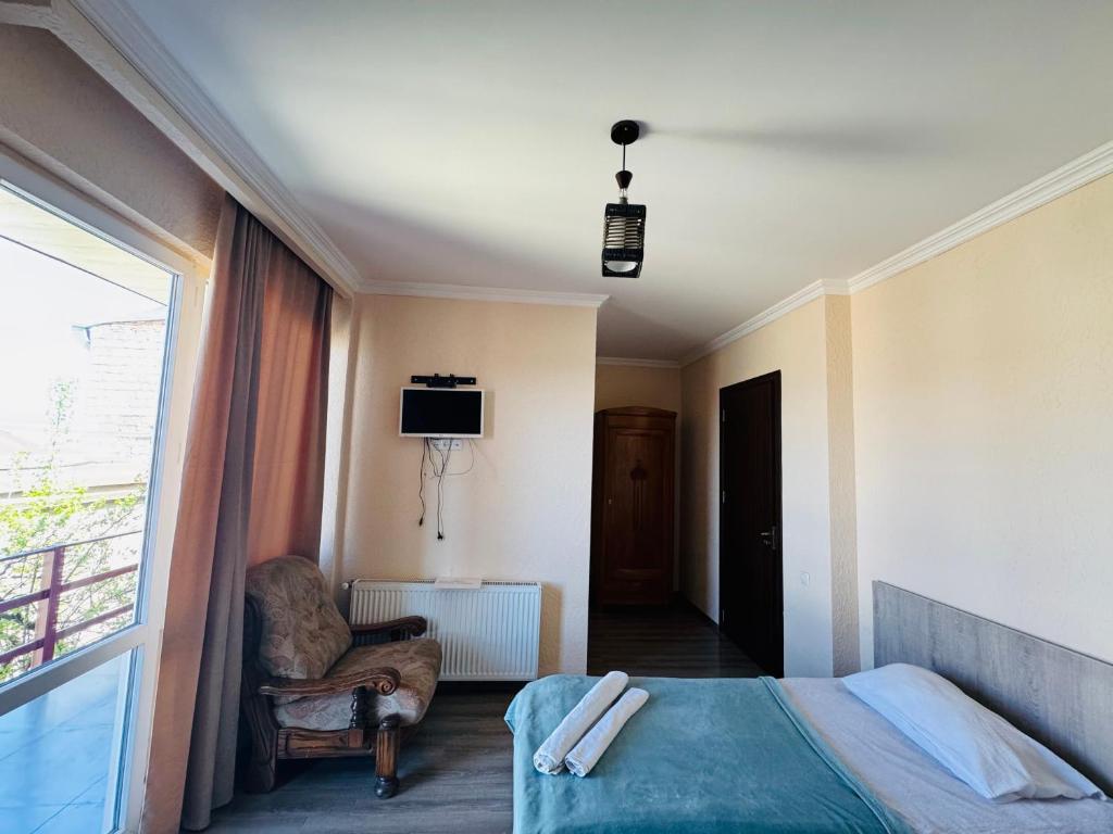 Postel nebo postele na pokoji v ubytování Guest House Sanapiro