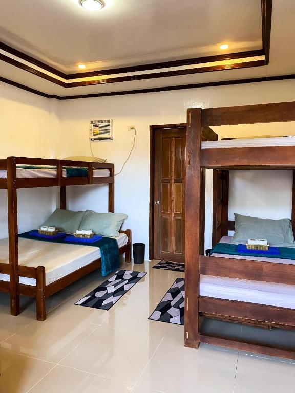 Postel nebo postele na pokoji v ubytování Hapitanan Hostel Siargao