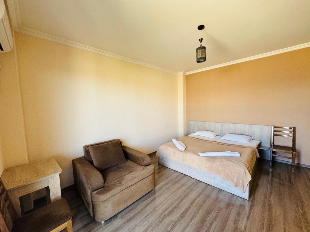 Postel nebo postele na pokoji v ubytování Guest House Sanapiro