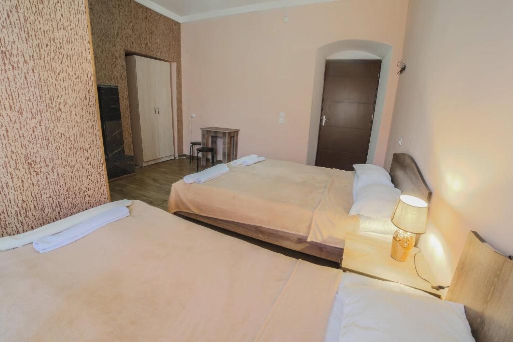Postel nebo postele na pokoji v ubytování Guest House Sanapiro