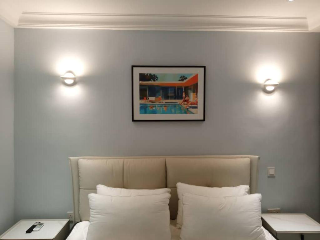Postel nebo postele na pokoji v ubytování Grandwest Apartment Ajah