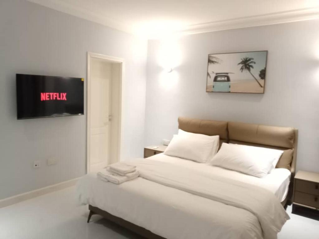 Postel nebo postele na pokoji v ubytování Grandwest Apartment Ajah