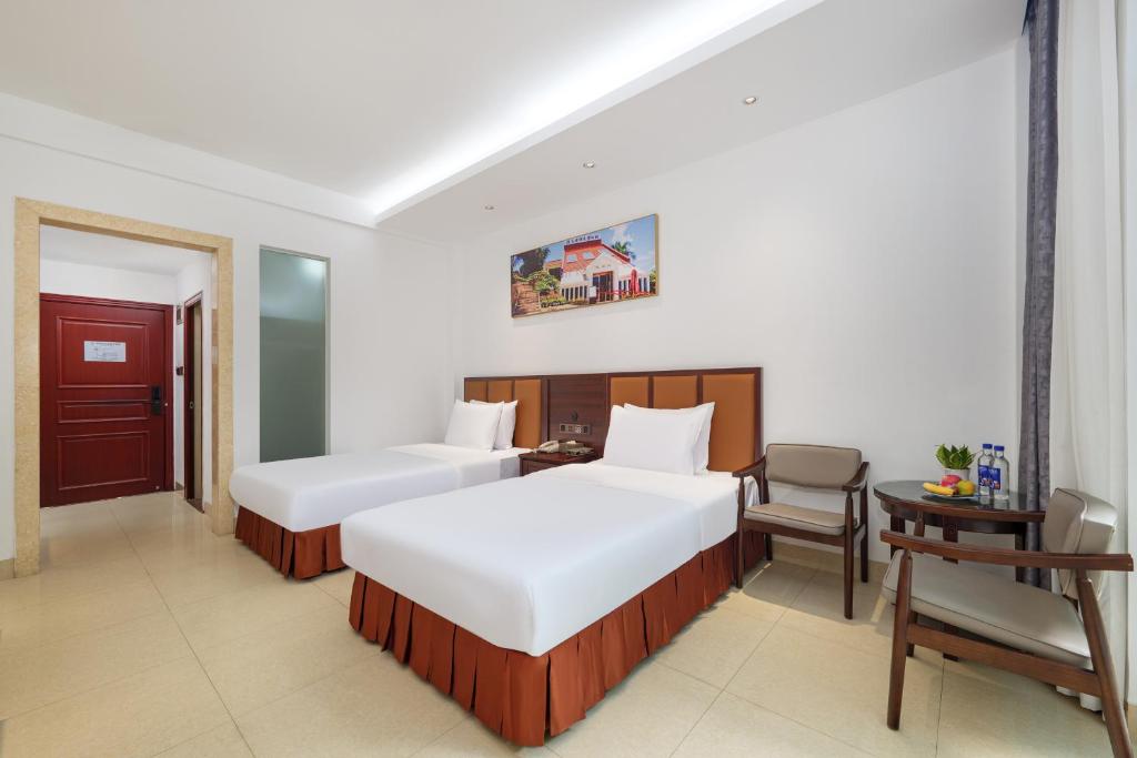 Postel nebo postele na pokoji v ubytování Xiamen Kulangsu Resort Hotel