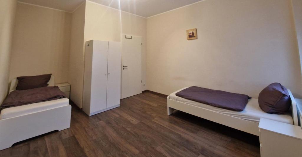 Ένα ή περισσότερα κρεβάτια σε δωμάτιο στο VS Workers Apartment T1-6