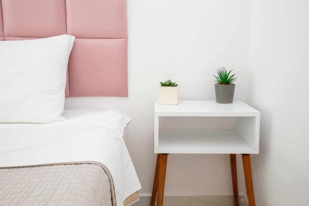 Postel nebo postele na pokoji v ubytování MaK Apartments
