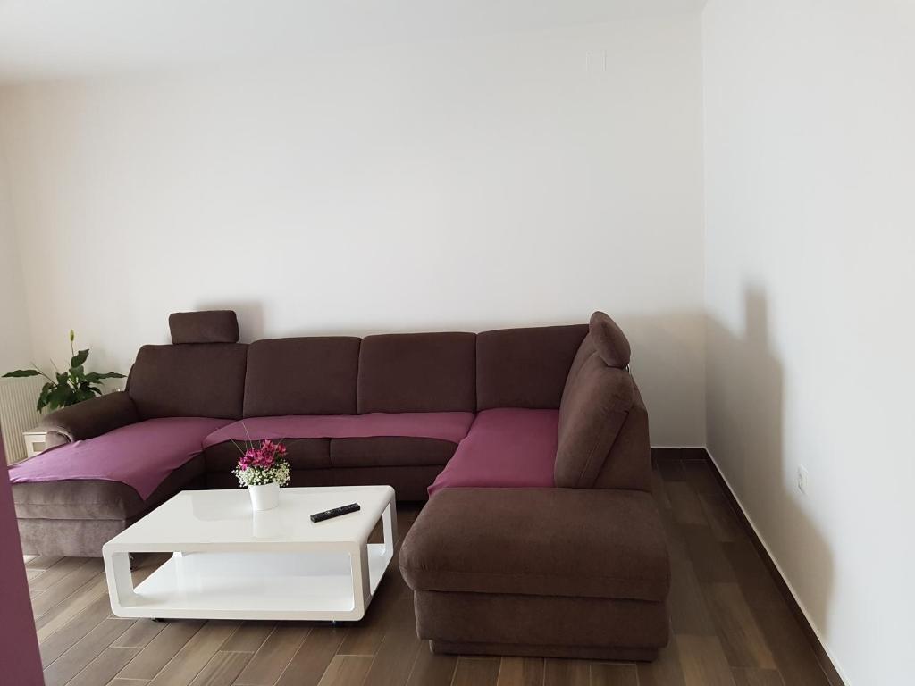 a living room with a couch and a table at Apartments Tereza in Senj