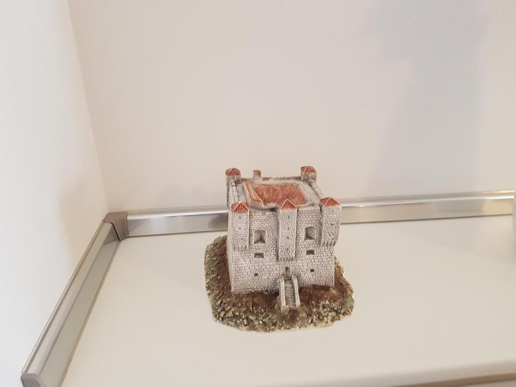 a model of a building on a shelf in a room at Apartments Tereza in Senj