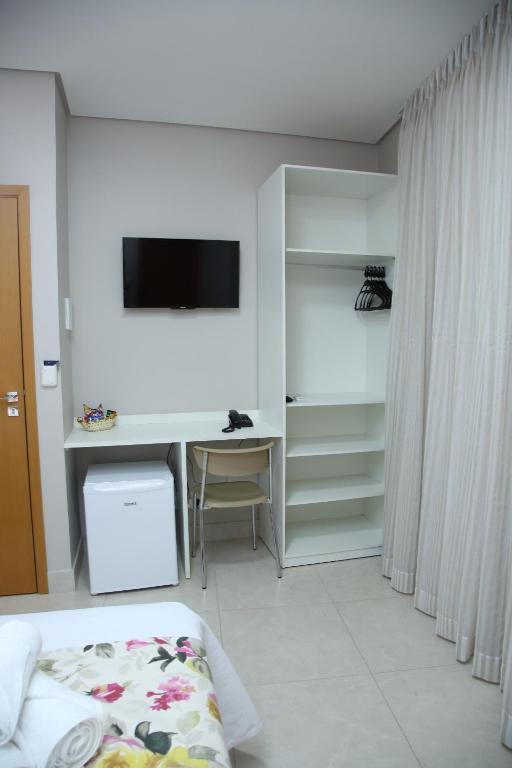 TV a/nebo společenská místnost v ubytování Ventura Hotel