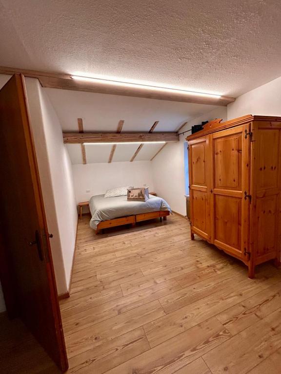 Łóżko lub łóżka w pokoju w obiekcie Agritur Broch