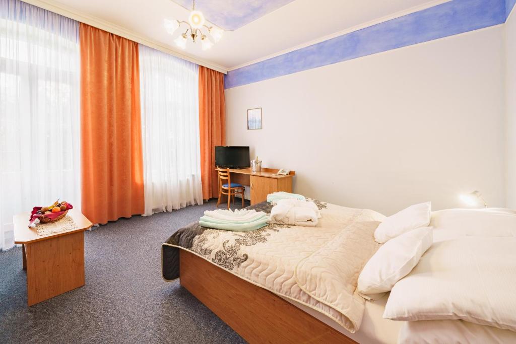 Postel nebo postele na pokoji v ubytování Lázeňský dům Erika