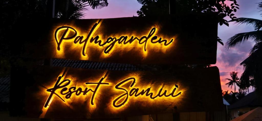 a sign that saysynchronous resort sandwich in front of a sunset at Palmgarden Resort Samui - only Adult - neu Saniert in Ban Tai