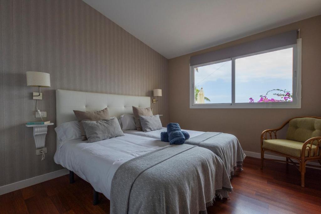 Postel nebo postele na pokoji v ubytování Top Luxury Villa to the Ocean