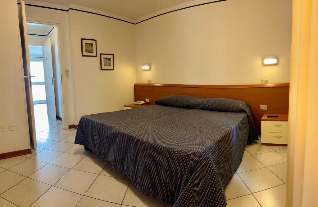 Postel nebo postele na pokoji v ubytování Hotel Excelsior