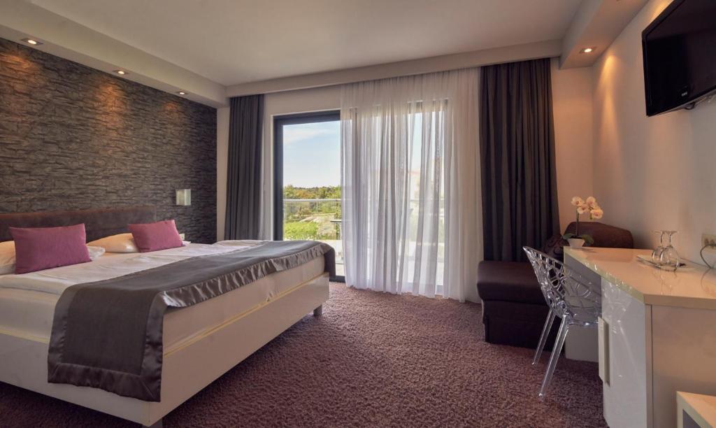 Postel nebo postele na pokoji v ubytování Boutique Hotel Life