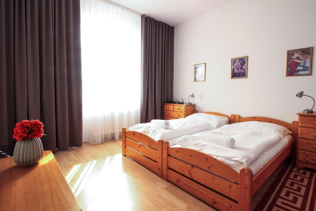 Postel nebo postele na pokoji v ubytování Hotel Palác Elektra