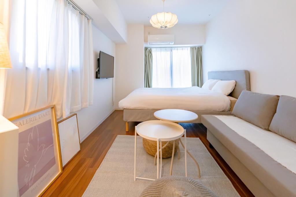 Postel nebo postele na pokoji v ubytování Suke Home Oshiage
