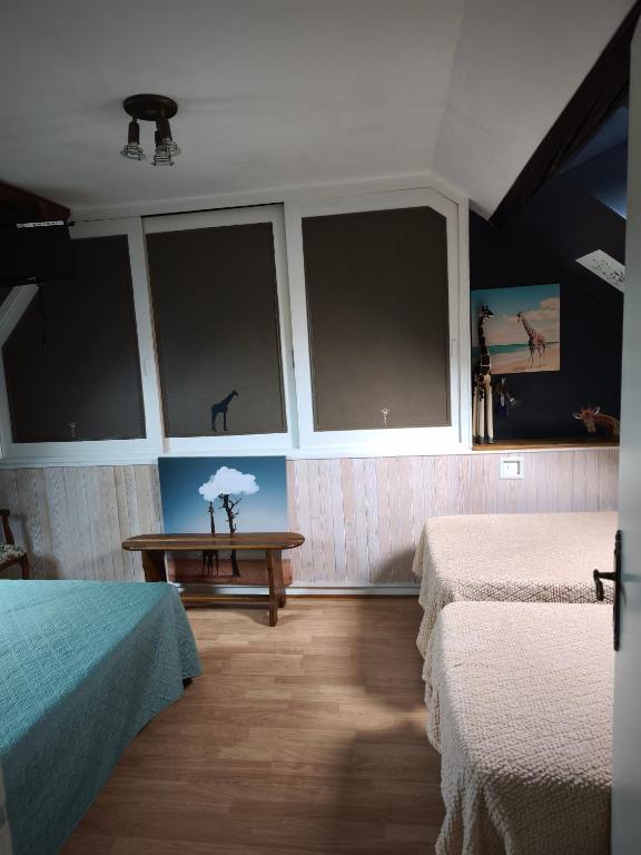 Posteľ alebo postele v izbe v ubytovaní la ferme des bigornes