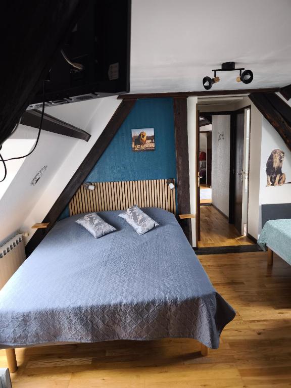 Posteľ alebo postele v izbe v ubytovaní la ferme des bigornes