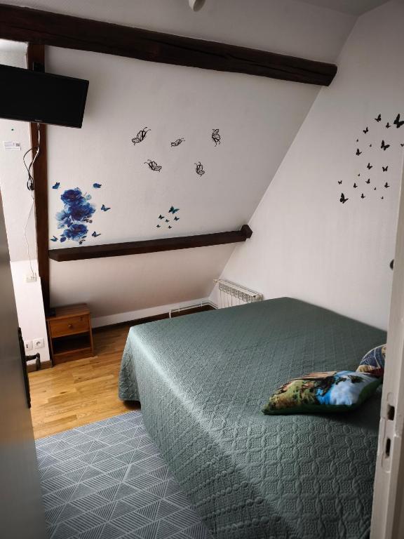 Posteľ alebo postele v izbe v ubytovaní la ferme des bigornes
