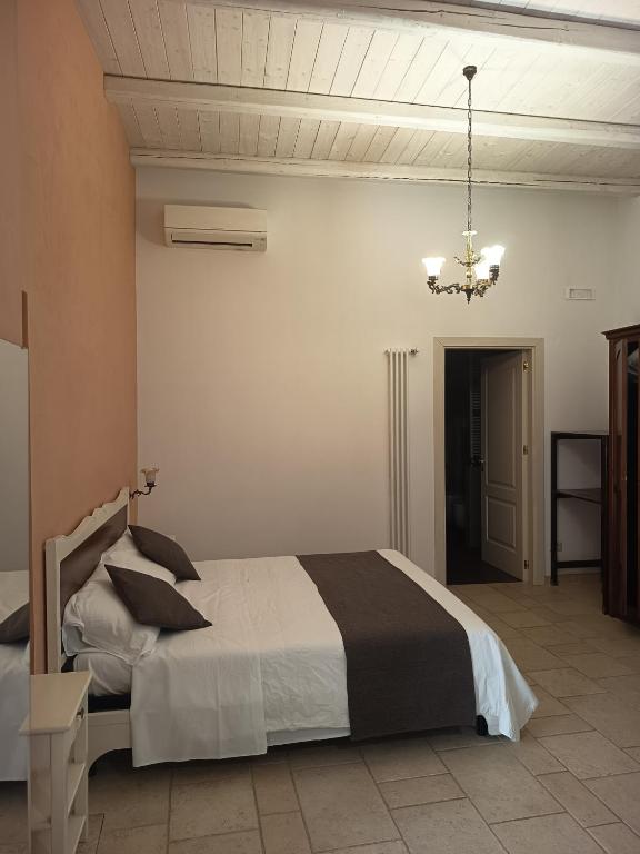 Postel nebo postele na pokoji v ubytování B&B Il Mulino del Monastero