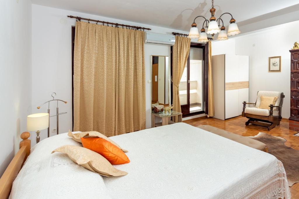 Posteľ alebo postele v izbe v ubytovaní Apartments Cordis