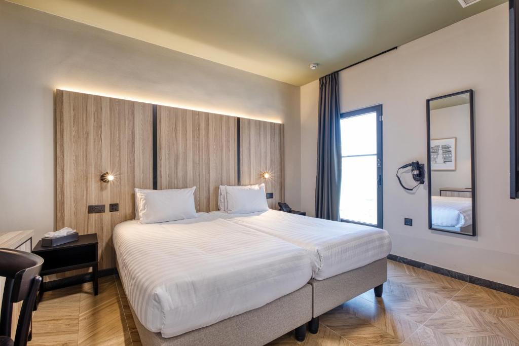 Postel nebo postele na pokoji v ubytování VITA Hotel