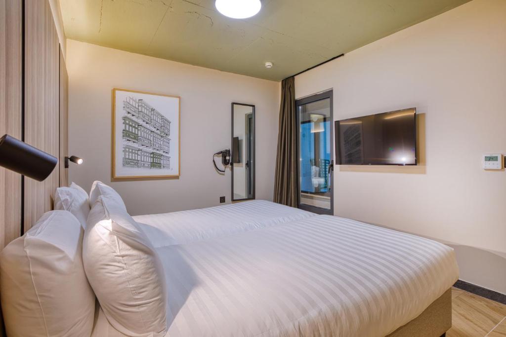 TV a/nebo společenská místnost v ubytování VITA Hotel