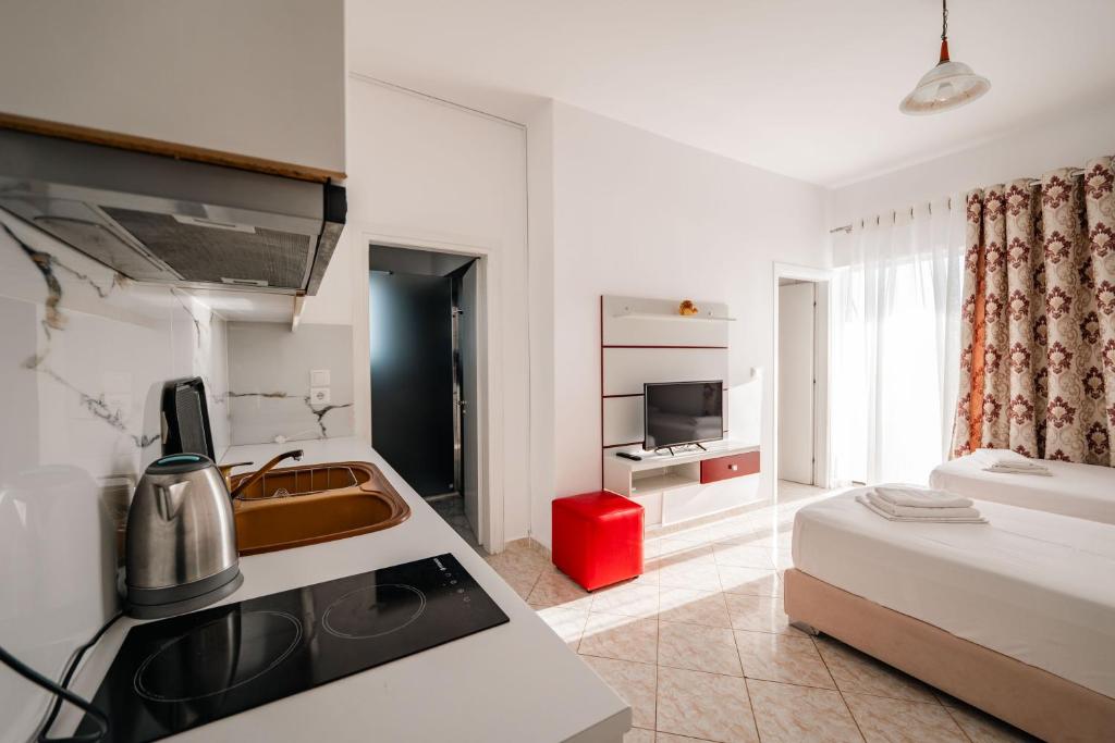 Postel nebo postele na pokoji v ubytování Eleni Guest House