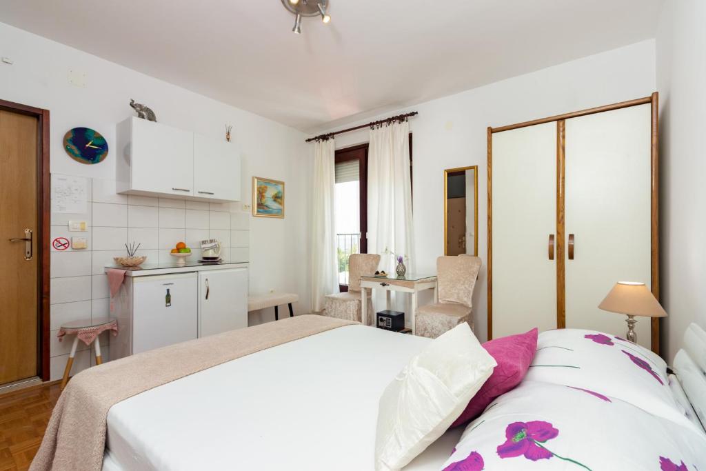 Posteľ alebo postele v izbe v ubytovaní Apartments Cordis