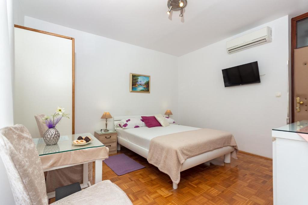Posteľ alebo postele v izbe v ubytovaní Apartments Cordis
