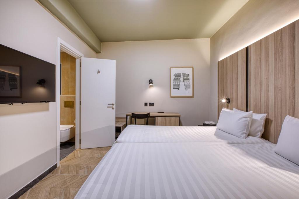 Postel nebo postele na pokoji v ubytování VITA Hotel