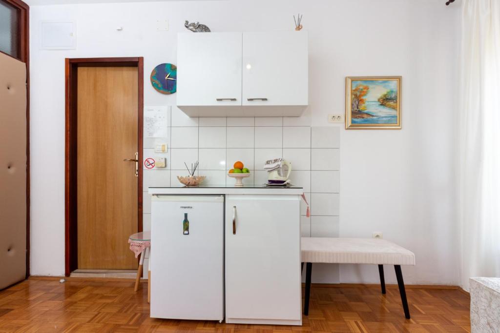 Kuchyňa alebo kuchynka v ubytovaní Apartments Cordis