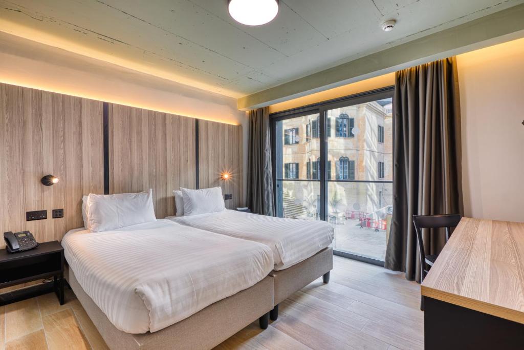 Postel nebo postele na pokoji v ubytování VITA Hotel